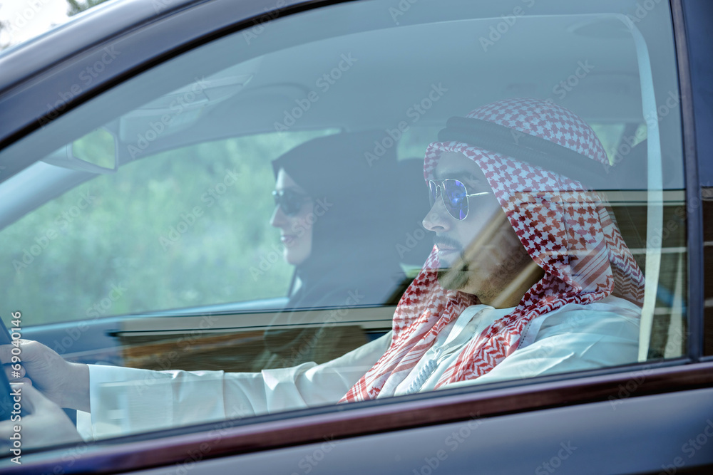 Young Arabic Couple In Car