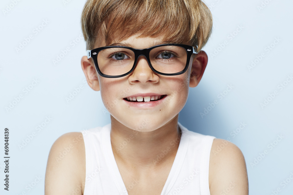 Portrait of young boy wearing glasses, studio. Portrait of young boy wearing glasses, studio.