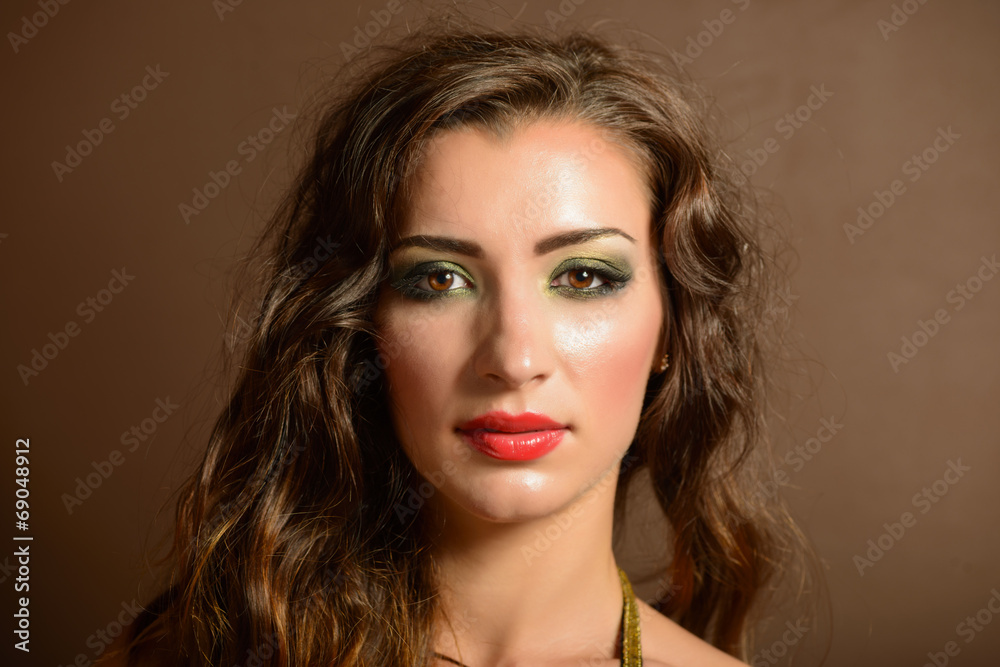 Fototapeta premium Portrait of beautiful young woman with bright make-up