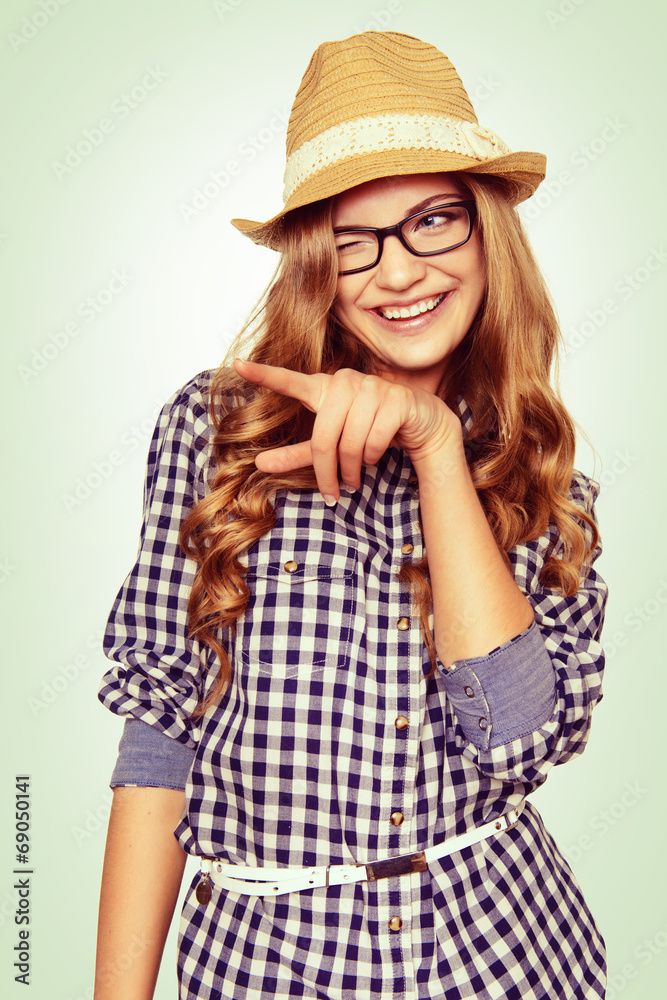 portrait of a cute young woman with casual garb pointing to the portrait of a cute young woman with casual garb pointing to the
