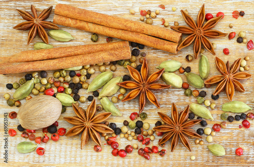 Fototapeta Naklejka Na Ścianę i Meble -  Selection of spices and herbs on wooden surface