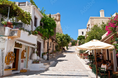 Tourists have a rest in the old town of Rethymno. Crete, Greece.