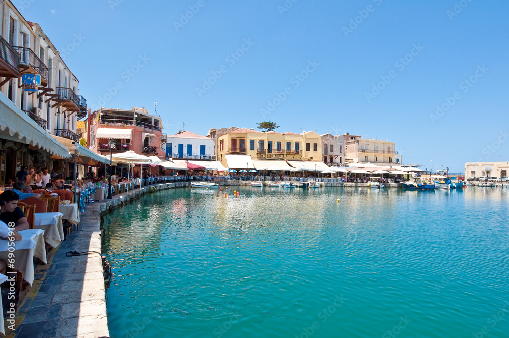 The venetian harbour with bars and restaurants. Crete, Greece.