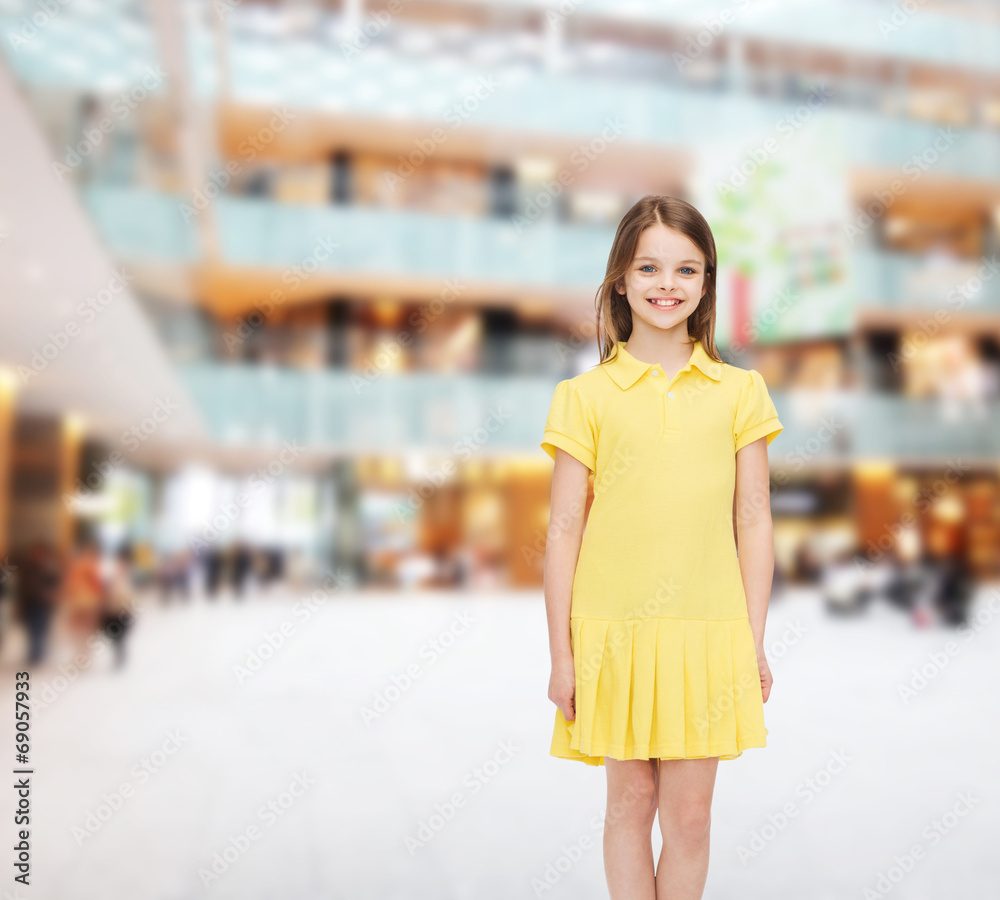 smiling little girl in yellow dress