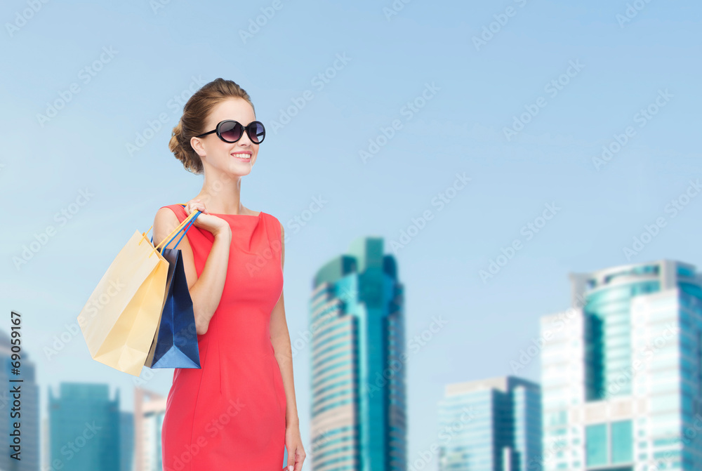 smiling elegant woman in dress with shopping bags smiling elegant woman in dress with shopping bags