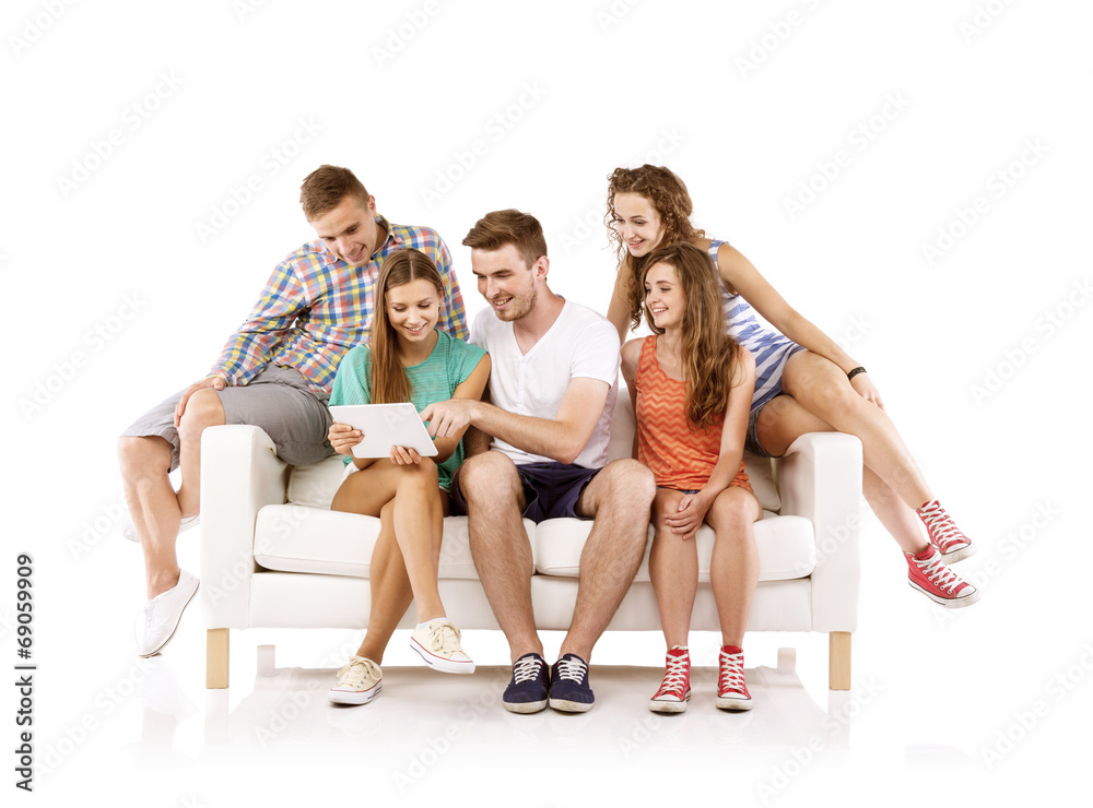 Group of young people on sofa with tablet Group of young people on sofa with tablet