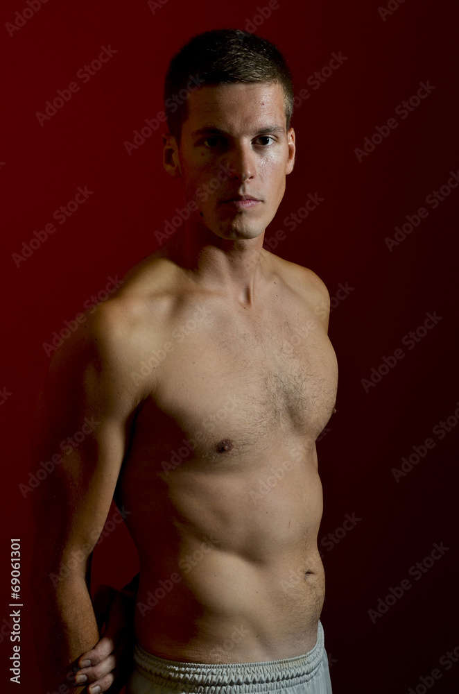 Fototapeta premium Young male model posing with bare chest
