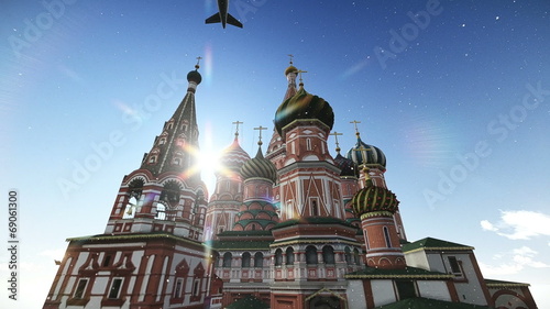 Plane passing at The Cathedral of Vasily the Blessed in Moscow photo