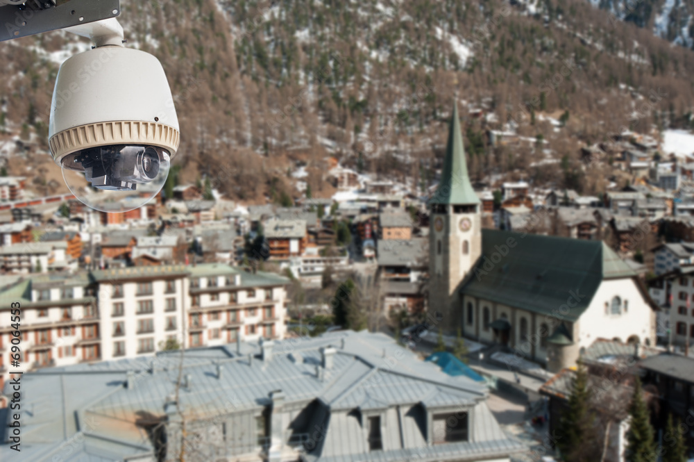 CCTV Camera Operating in city with church in background