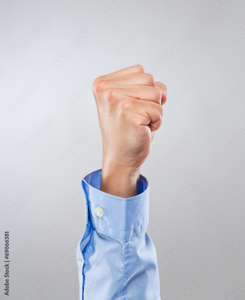 Businessman hand with clutched fist Businessman hand with clutched fist