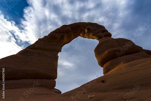 Beautiful sunset sky over Delicate Arch from below