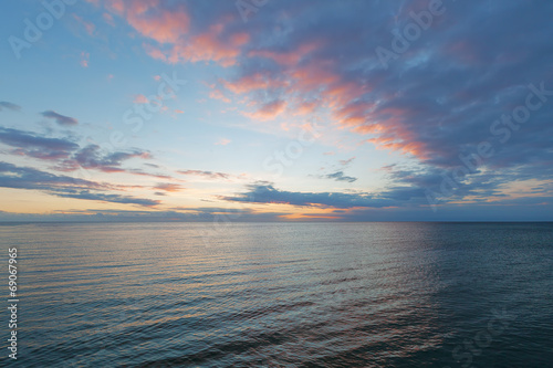 Smooth water surface in orange sunset  colors