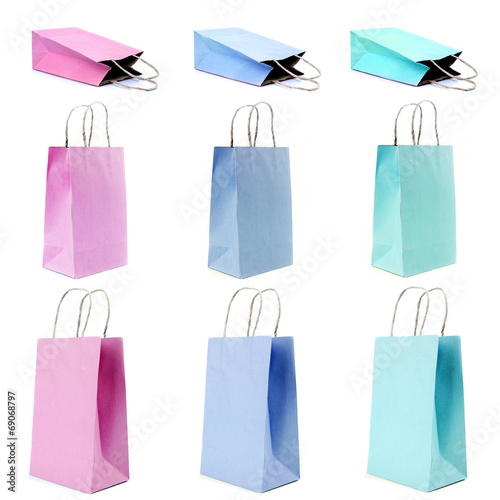 nine empty shopping paper bags in pastel colors.
