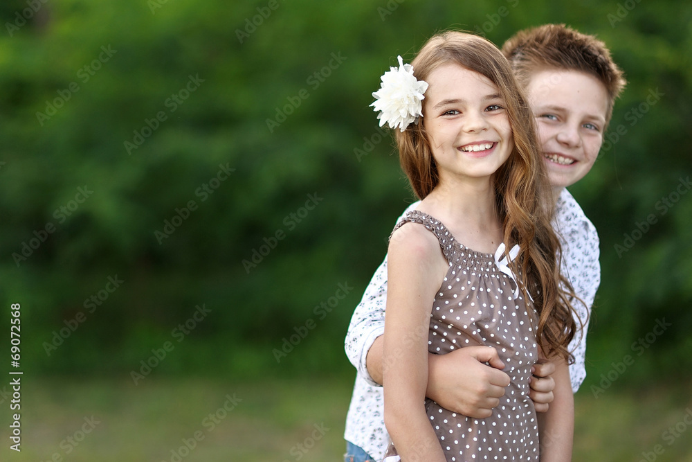 Obraz premium Portrait of a boy girl in a summer