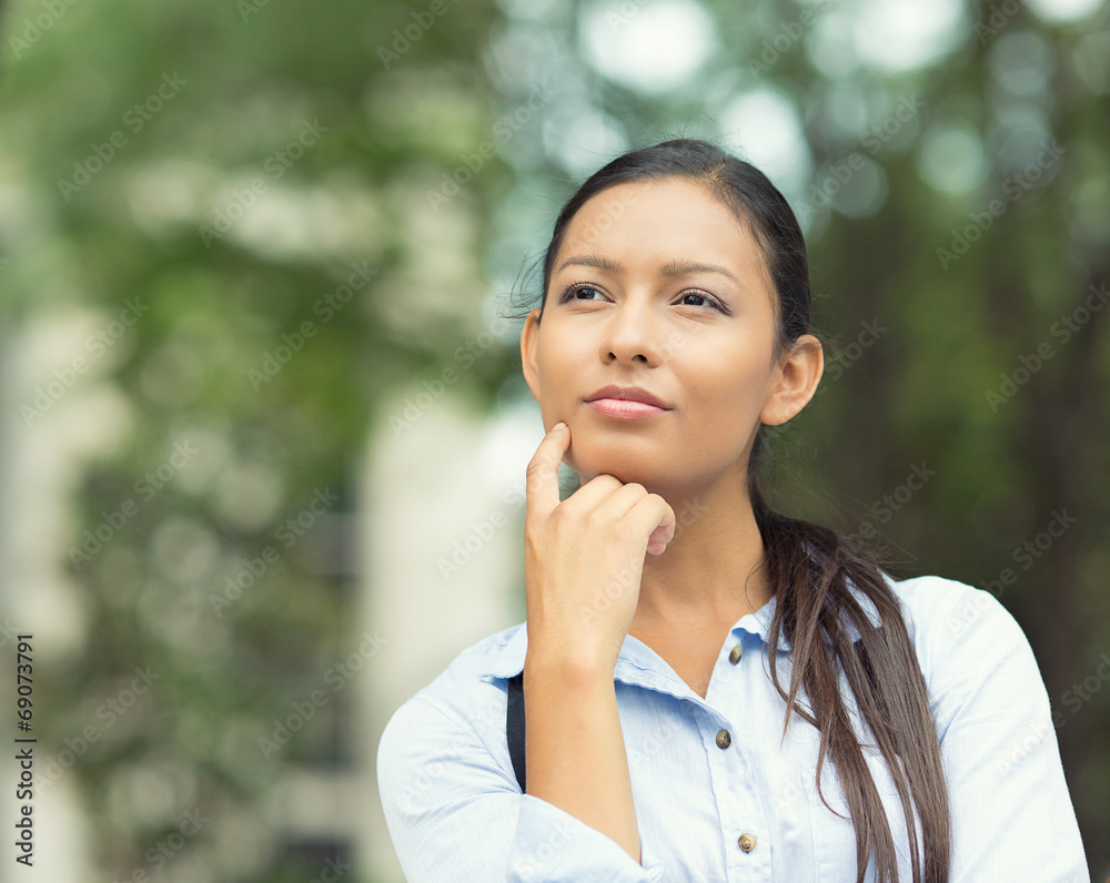 Young Businesswoman daydreaming, Thinking Young Businesswoman daydreaming, Thinking