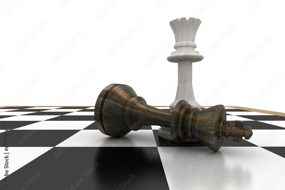 White king standing over fallen black queen White king standing over fallen black queen