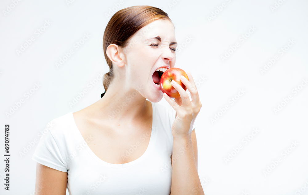 Woman holding and biting red apple, Healthy teeth Woman holding and biting red apple, Healthy teeth