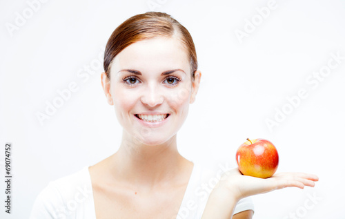 Woman holding and eating red apple, Healthy teeth