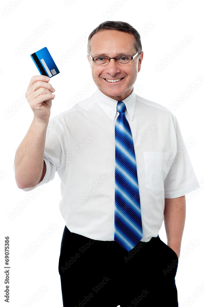 Senior executive showing his credit card Senior executive showing his credit card