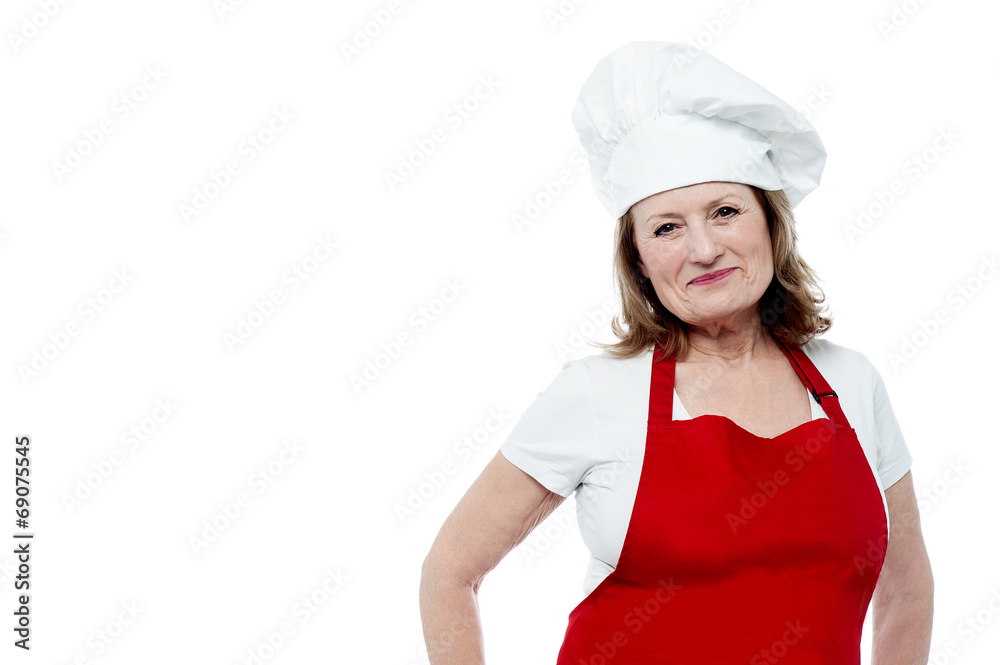 Aged female chef posing in style Aged female chef posing in style