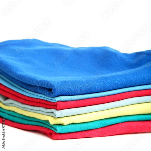 Stack of clothes on white background.