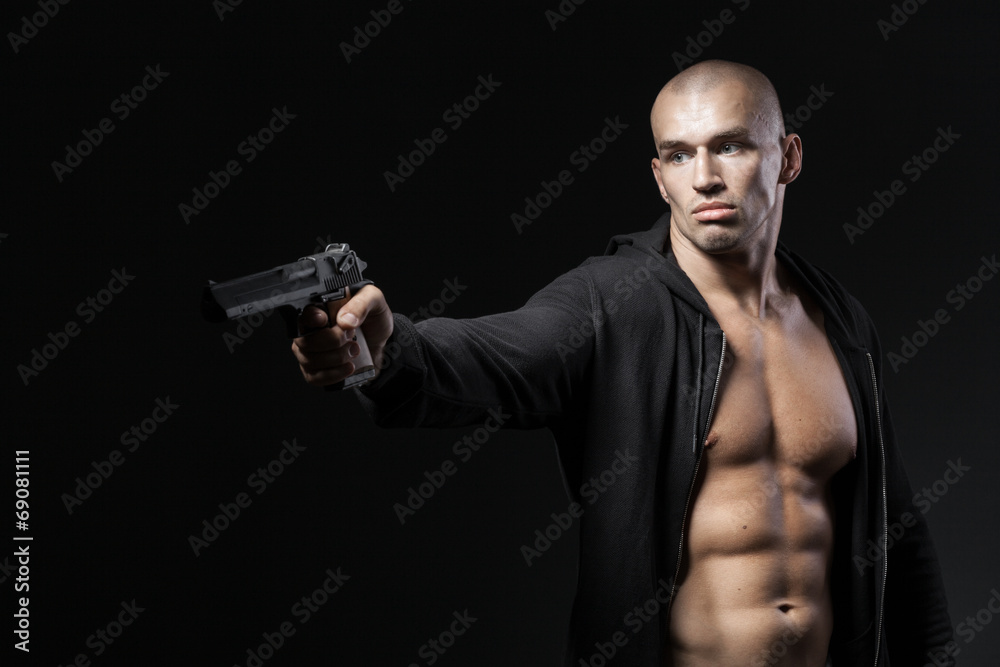 man shooting gun isolated on black background man shooting gun isolated on black background