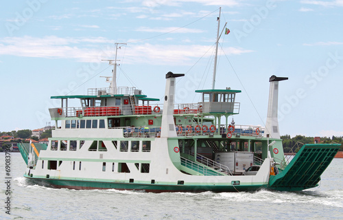 large ship for transport of cars in the lagoon in Venice photo