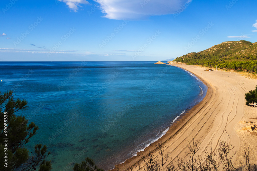 Ultramarine Mediterranean sea at nudist beach of Platja del Torn