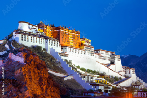 Potala palace at dusk in Lhasa, Tibet photo