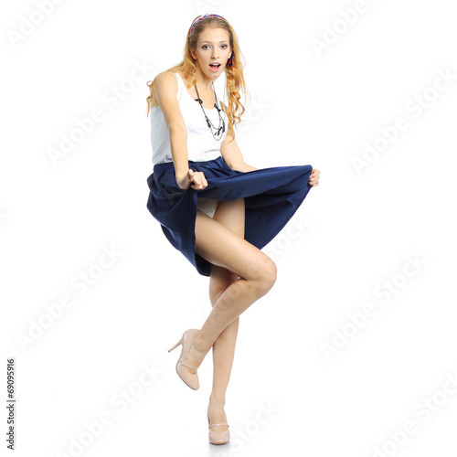 Emotional excited girl looking down and greatly surprised