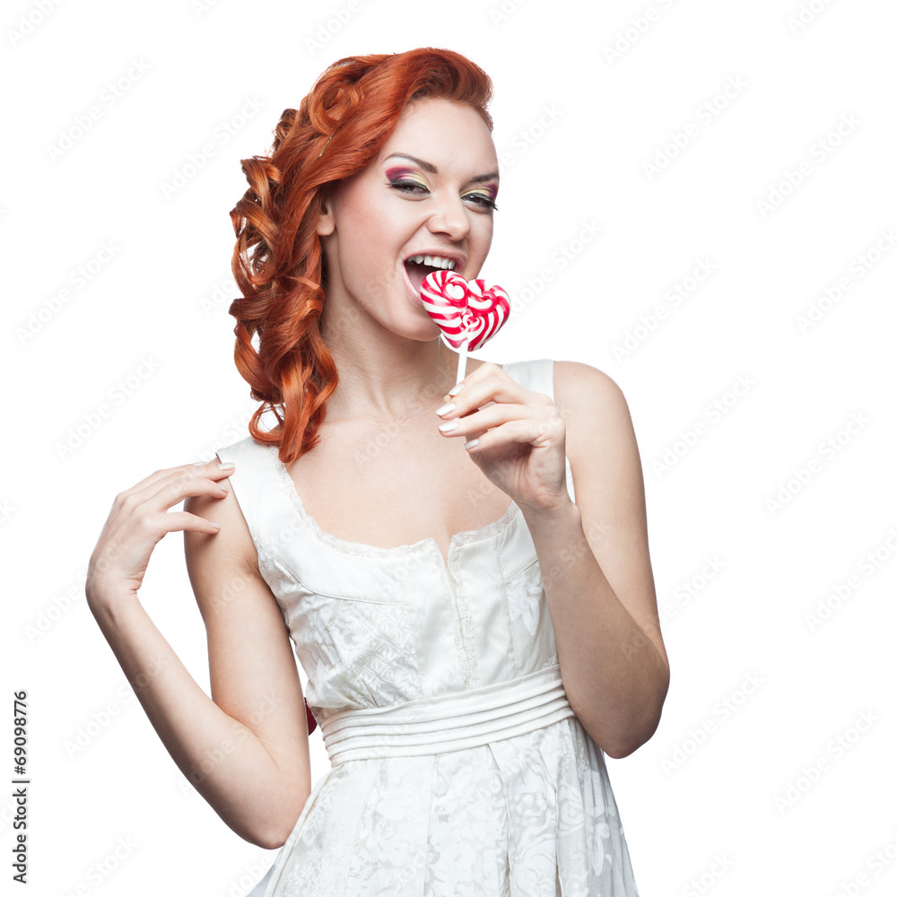 surprised red-haired woman holding lollipop surprised red-haired woman holding lollipop