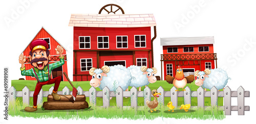 A farmer in front of the barnhouses