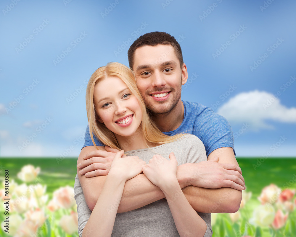 smiling couple hugging smiling couple hugging