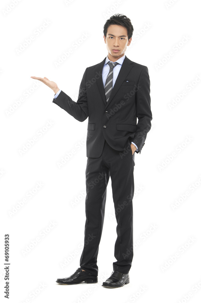 Asian business young man standing with open hand Asian business young man standing with open hand