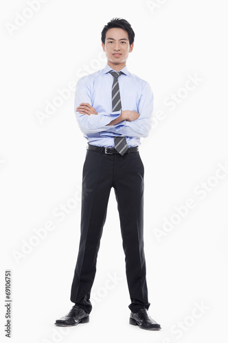 confident businessman with his hands in pockets