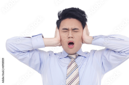 Stressed businessman tear his hair out, crazy face expression