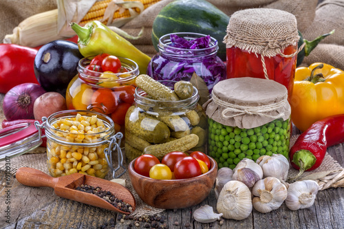 Canvastavla Several kinds of healthy domestic canned vegetables in jars