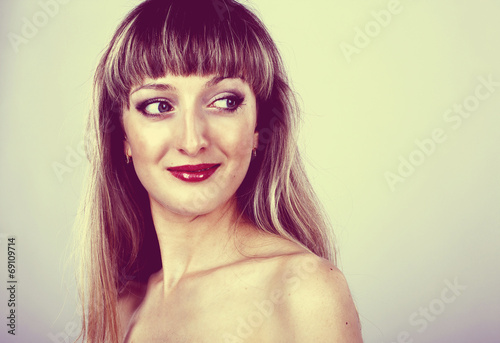 beautiful woman with long hair and blue eyes in the studio