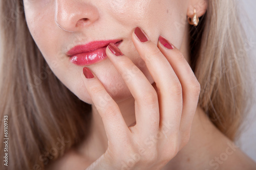 beautiful manicure and lips close up