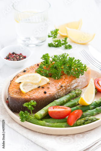 baked salmon with asparagus, parsley and lemon, vertical
