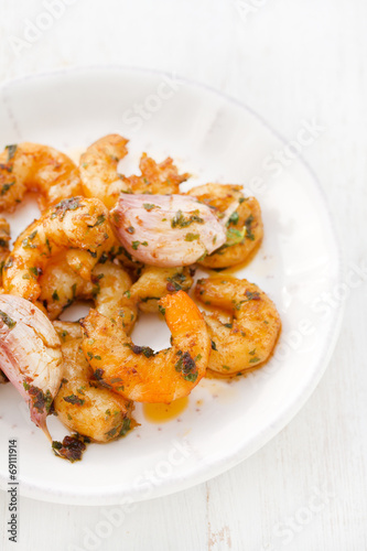 shrimps with garlic on white plate
