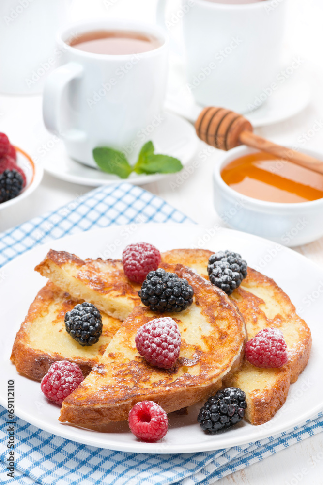 French toast with berries and powdered sugar for breakfast French toast with berries and powdered sugar for breakfast