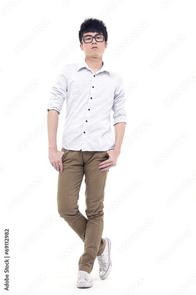 Fototapeta premium Young male in sunglasses posing in full length