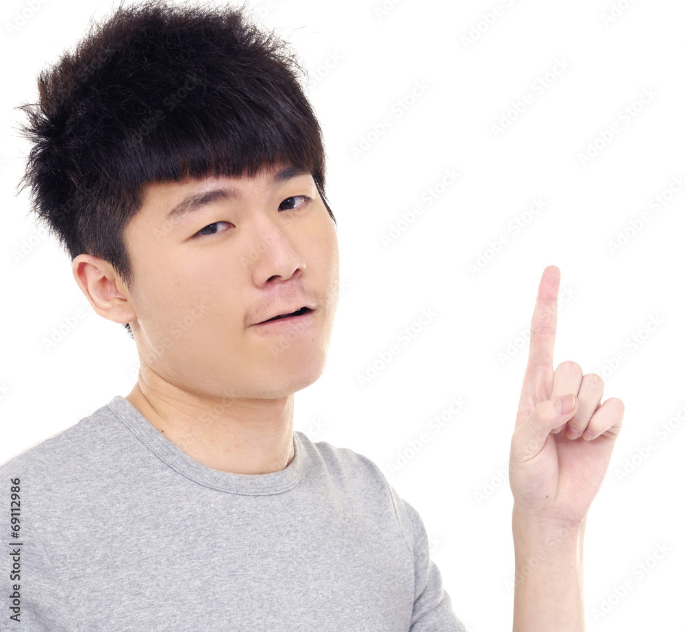 Portrait of young asian man pointing up