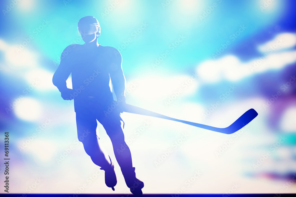 Obraz premium Hockey player skating on ice in arena night lights