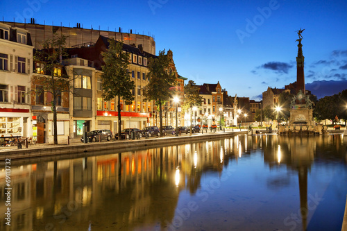 Houses reflectiong in water on the Saint Catherine square in Bru photo