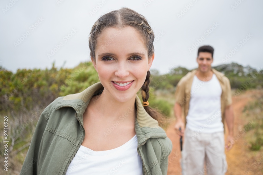 Obraz premium Hiking couple standing on mountain terrain