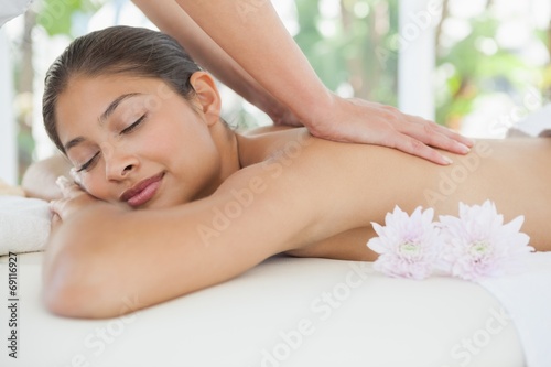 Beautiful brunette enjoying a back massage