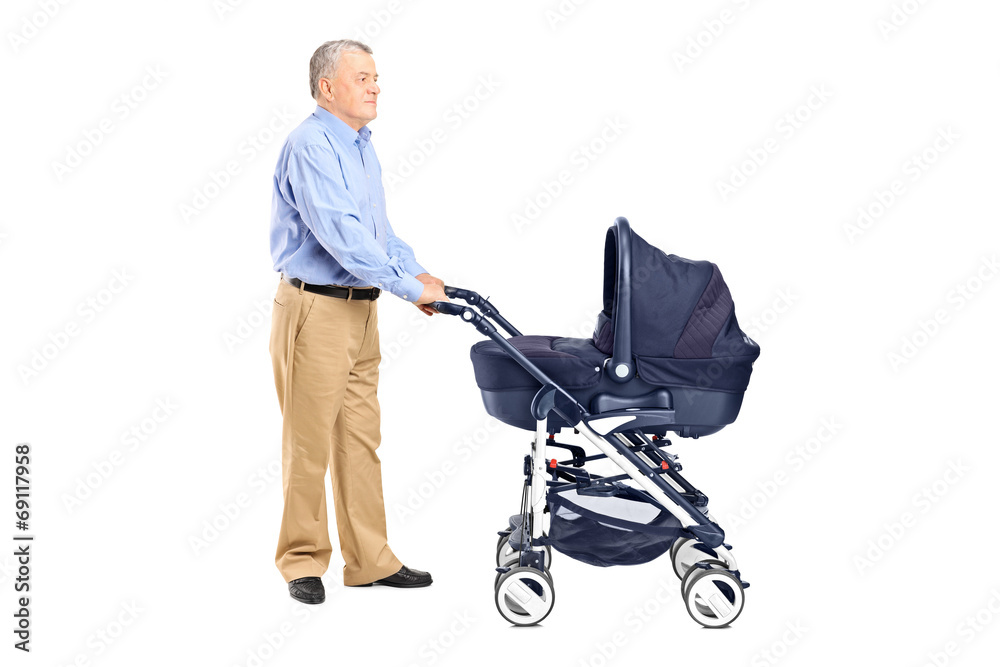 Grandfather pushing a baby stroller Grandfather pushing a baby stroller