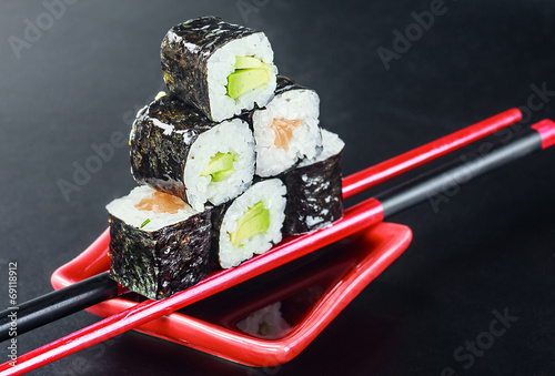 Pyramid of rolls on sticks for sush photo